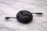 Close-up of cable reel mechanism showing textured surface details from 3D printing process