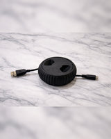 Compact USB cable reel in white, designed to organize and store 1.5m cables neatly