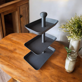 Detail of the expandable slot at the base of the serving tray