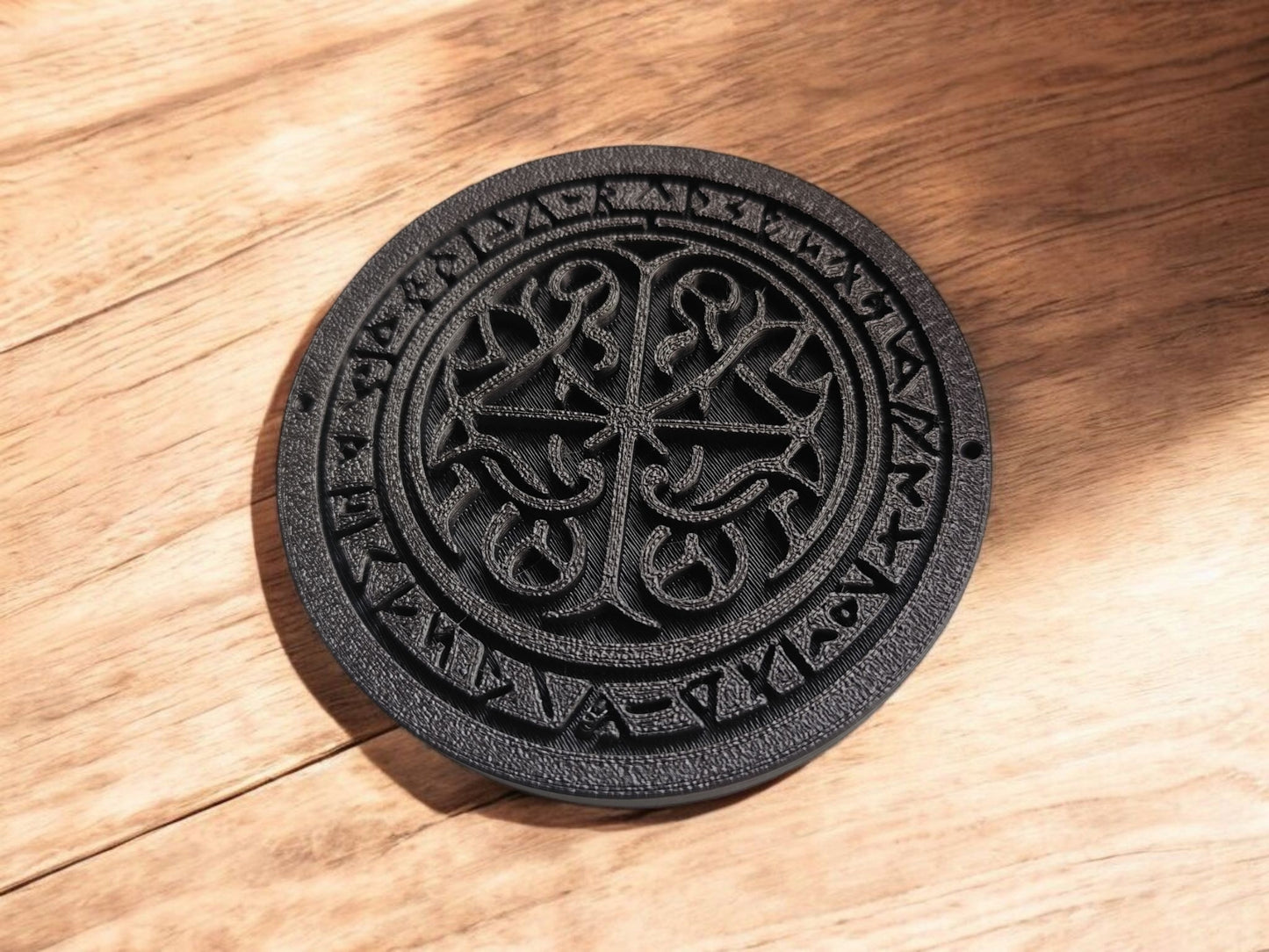 Runestone coaster placed beside a warm coffee cup on a light wooden table