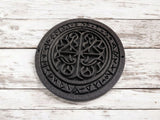 Detail view of the textured surface and rune symbols on the square runestone coaster
