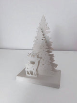 Christmas decoration with deer and tree design, tealight holder slot visible from the back