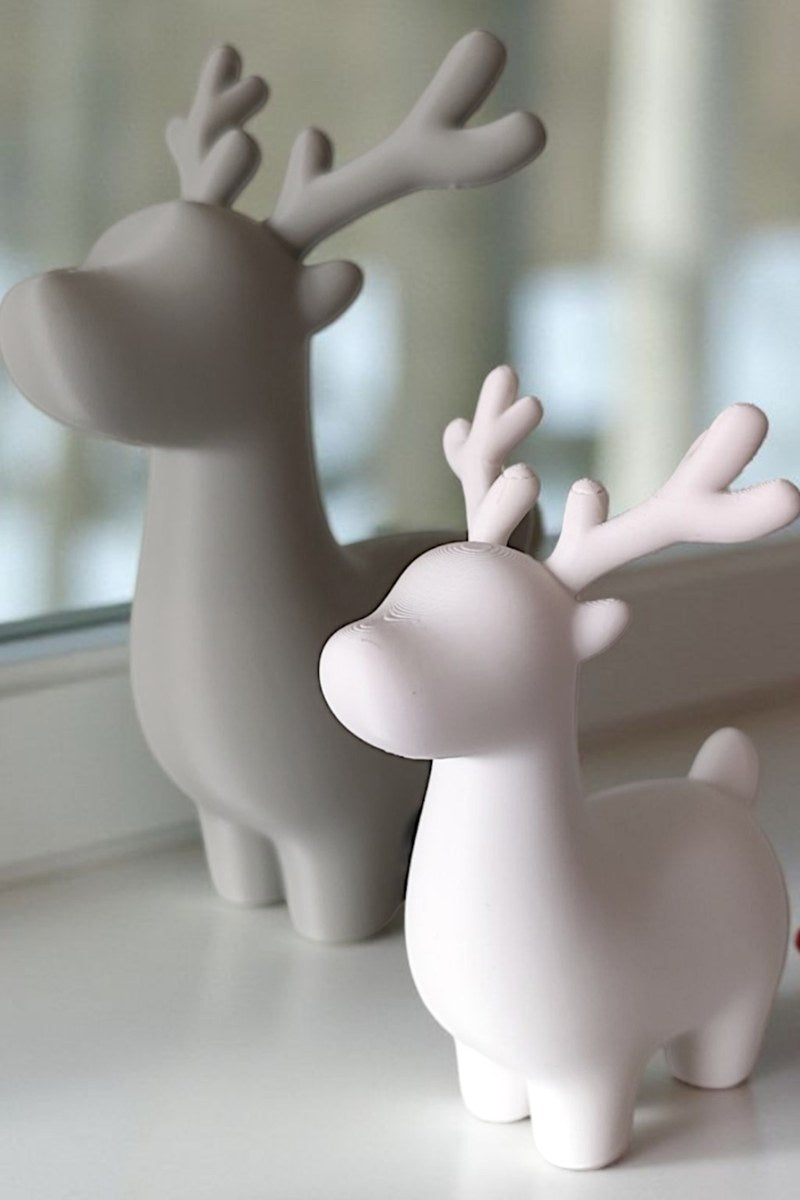 Close-up of minimalist Christmas reindeer decoration showing clean lines