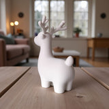 Close-up of minimalist Christmas reindeer decoration showing clean lines