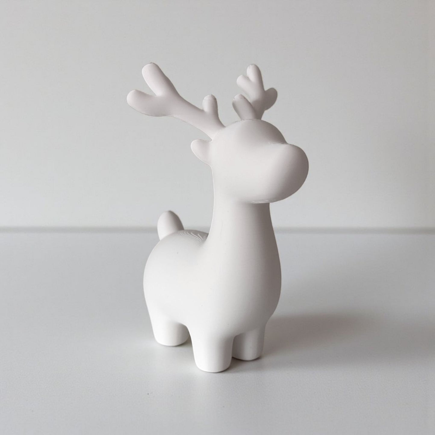 Close-up of minimalist Christmas reindeer decoration showing clean lines