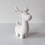 Close-up of minimalist Christmas reindeer decoration showing clean lines