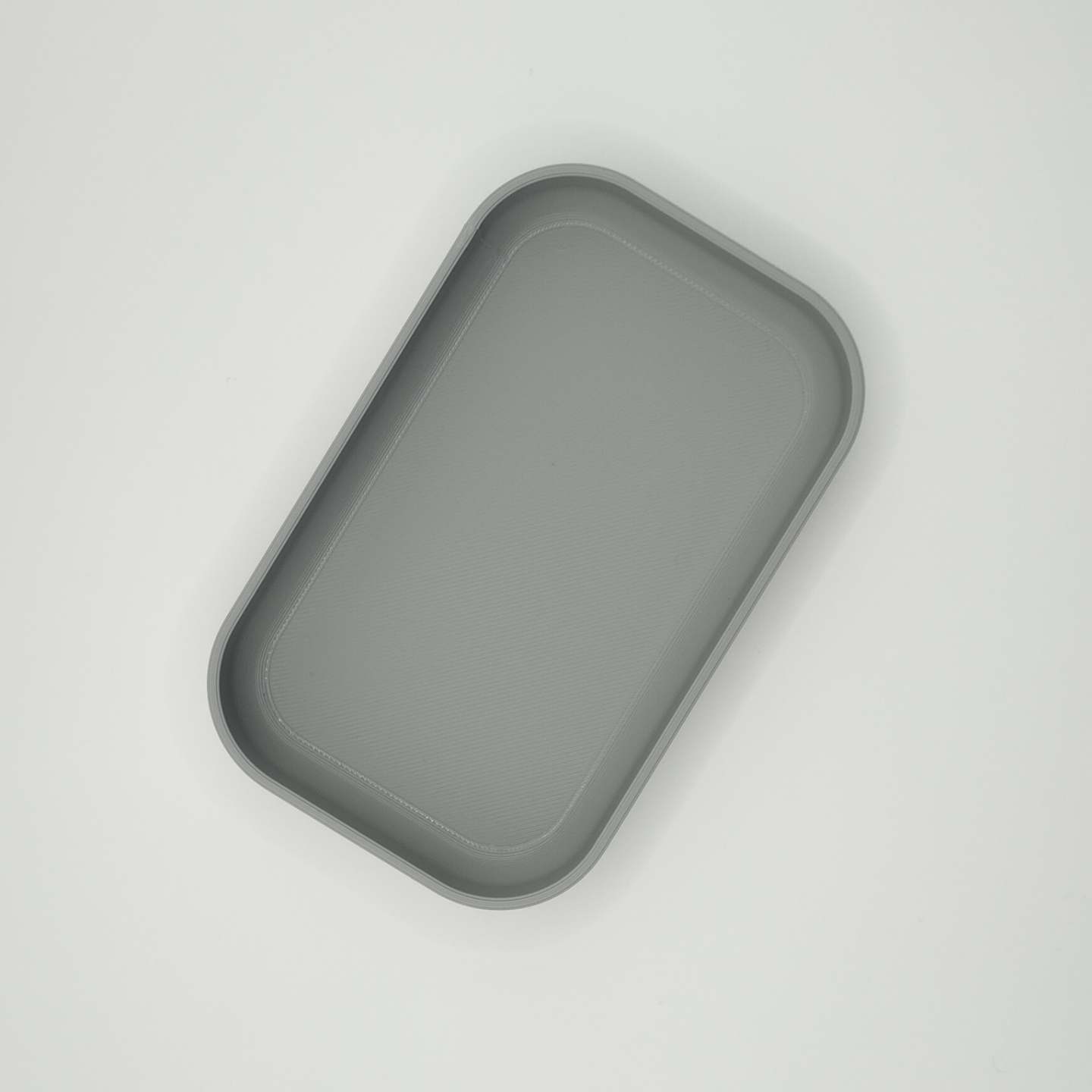 Close-up detail of curved edge and smooth finish on the key tray