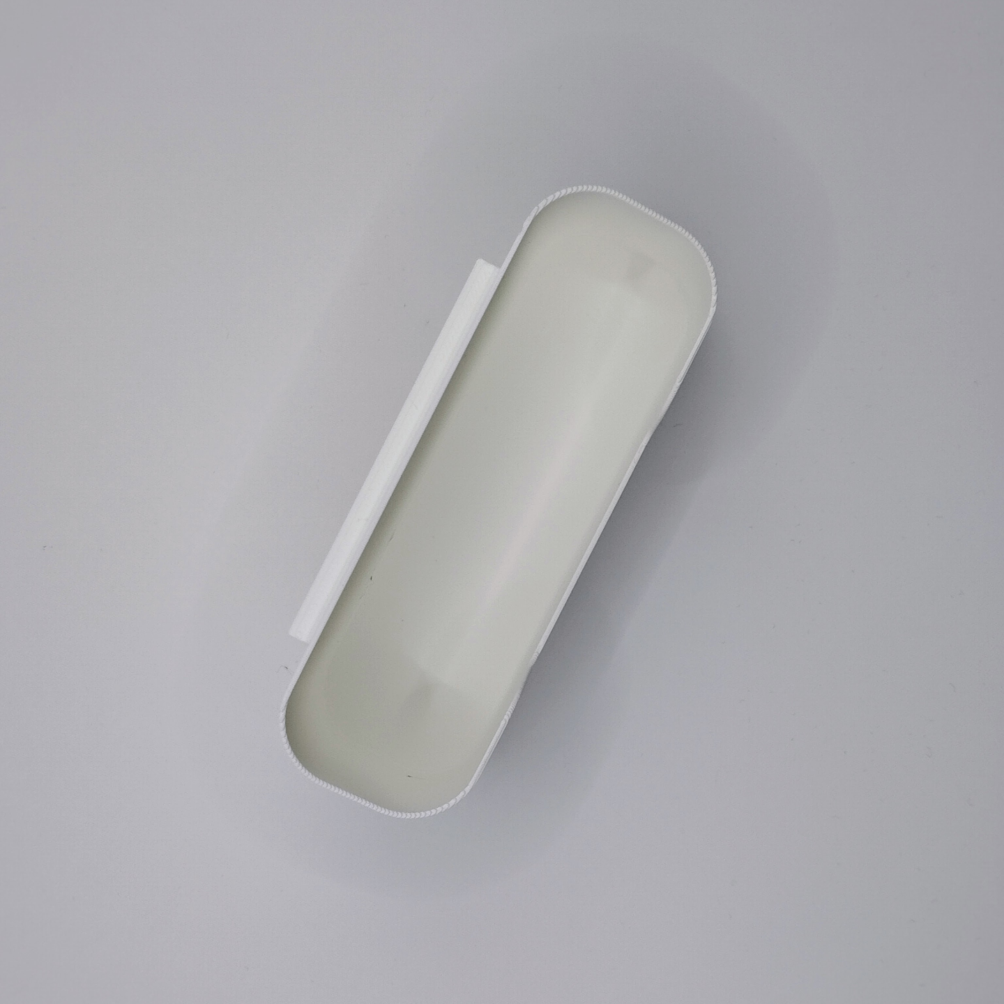 Detail of beveled edge on white wall organizer box