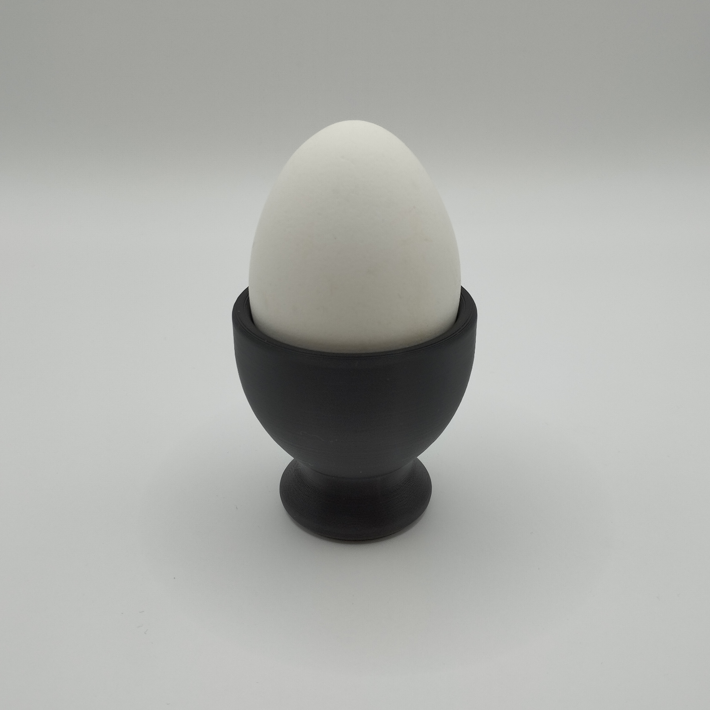 Detail of the smooth, refined surface texture of a modern egg cup