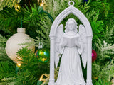 Victoriansk engel i gotisk buegang som juletræspynt