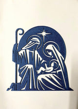 Julekrybbe i silhuet med Josef, Maria, Jesusbarnet og stjerne
