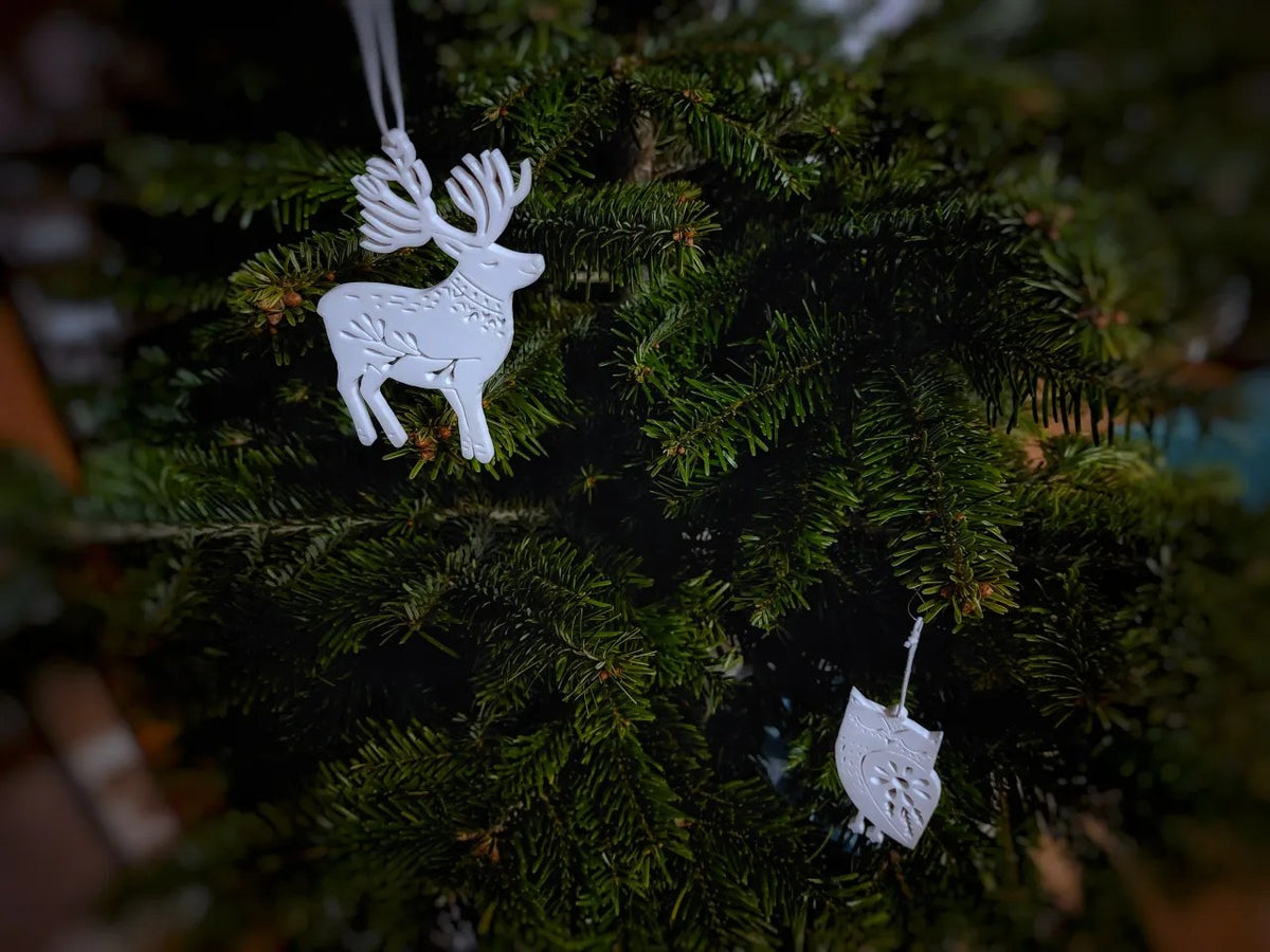 Otte juletræspynt formet som dyr