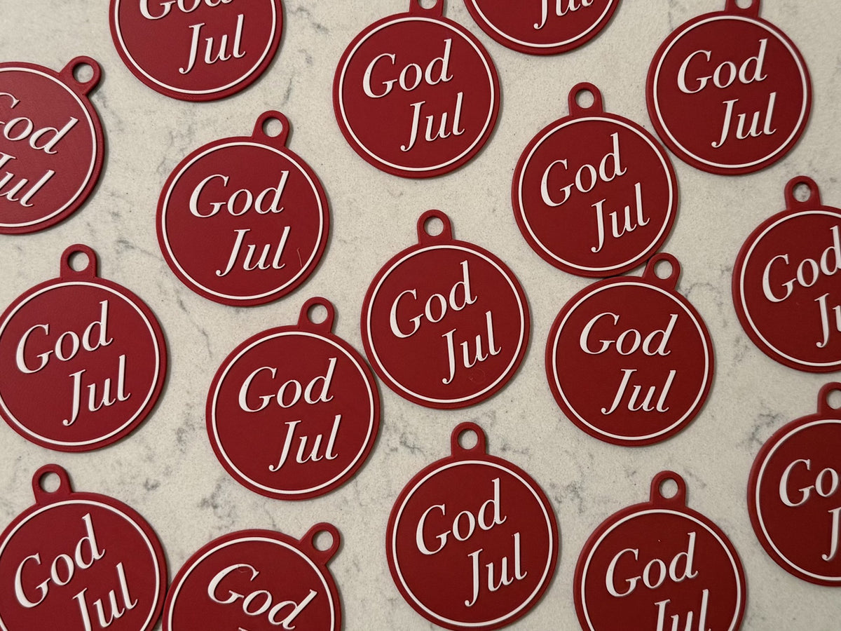 Elegant juletræspynt med teksten God Jul